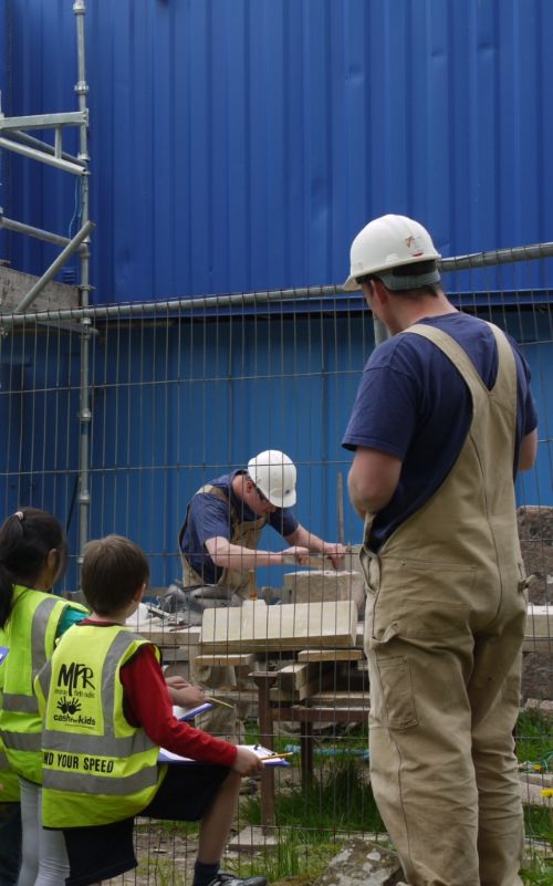 Andrew and George demonstrate stone cutting at the East Church, Cromarty